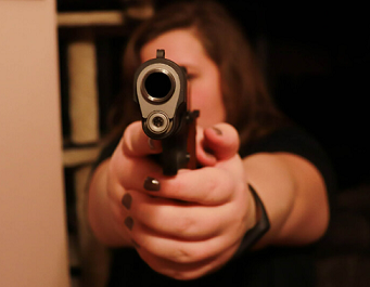Woman shooting gun